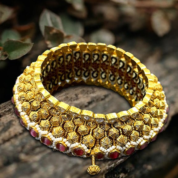 gold kada studded with tourmaline and red kundan.